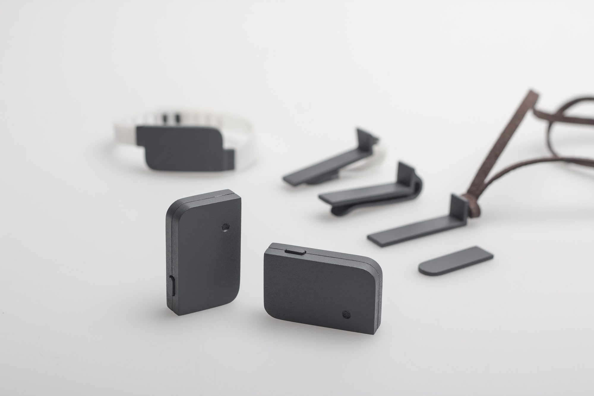 MNEMO system components: sensor wristband, clip-on camera and wearing options
