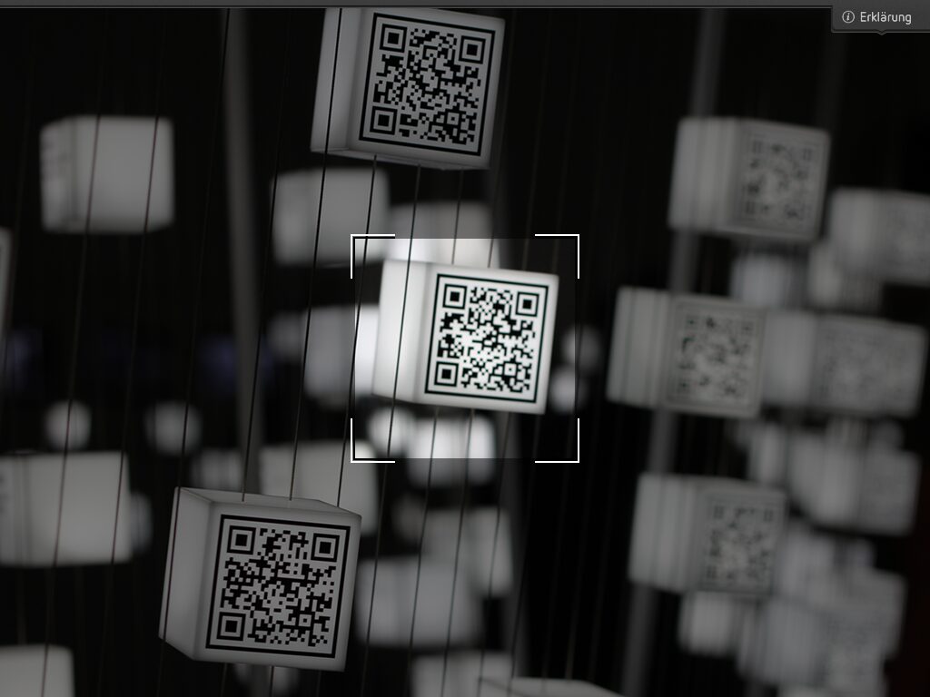 Scan mode of the 2011 exhibition app: a scan frame over blurred glowing cubes