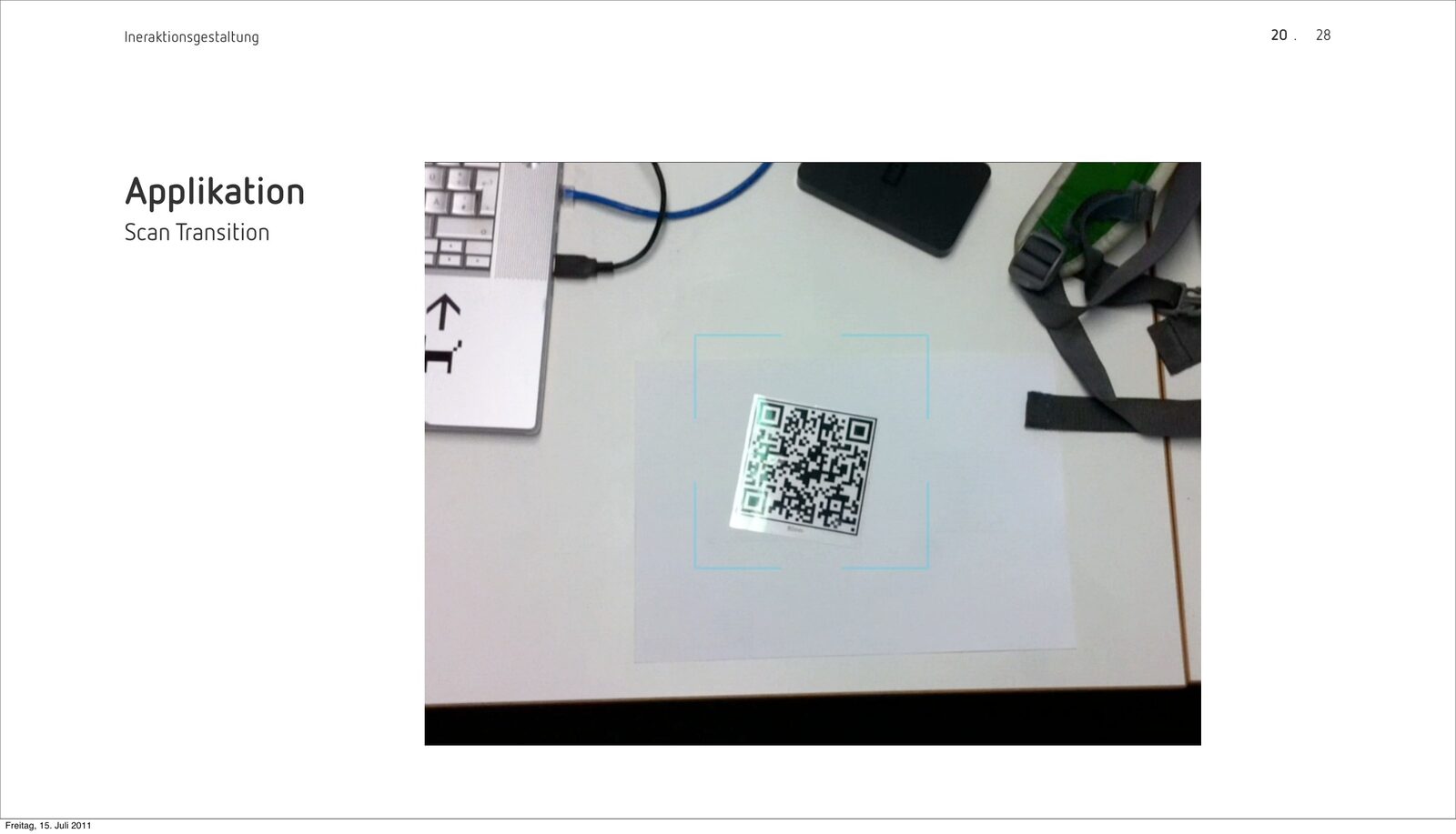 Presentation slide ‘Scan Transition’: a test photo of the scan frame closing around a printed QR code on a desk