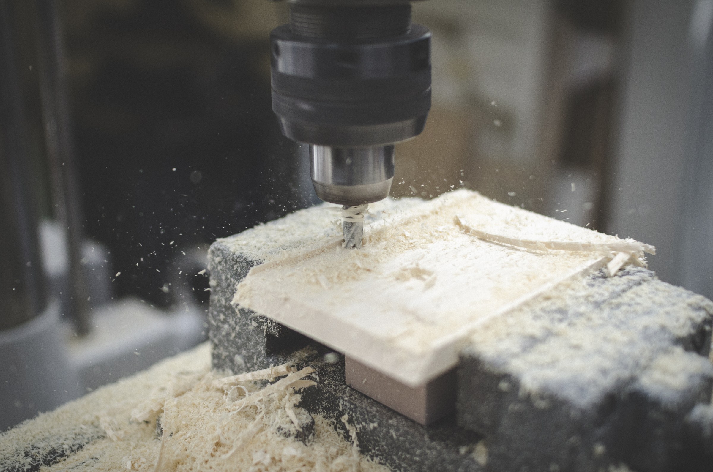 A drill shaping a wooden component of Brunhilde