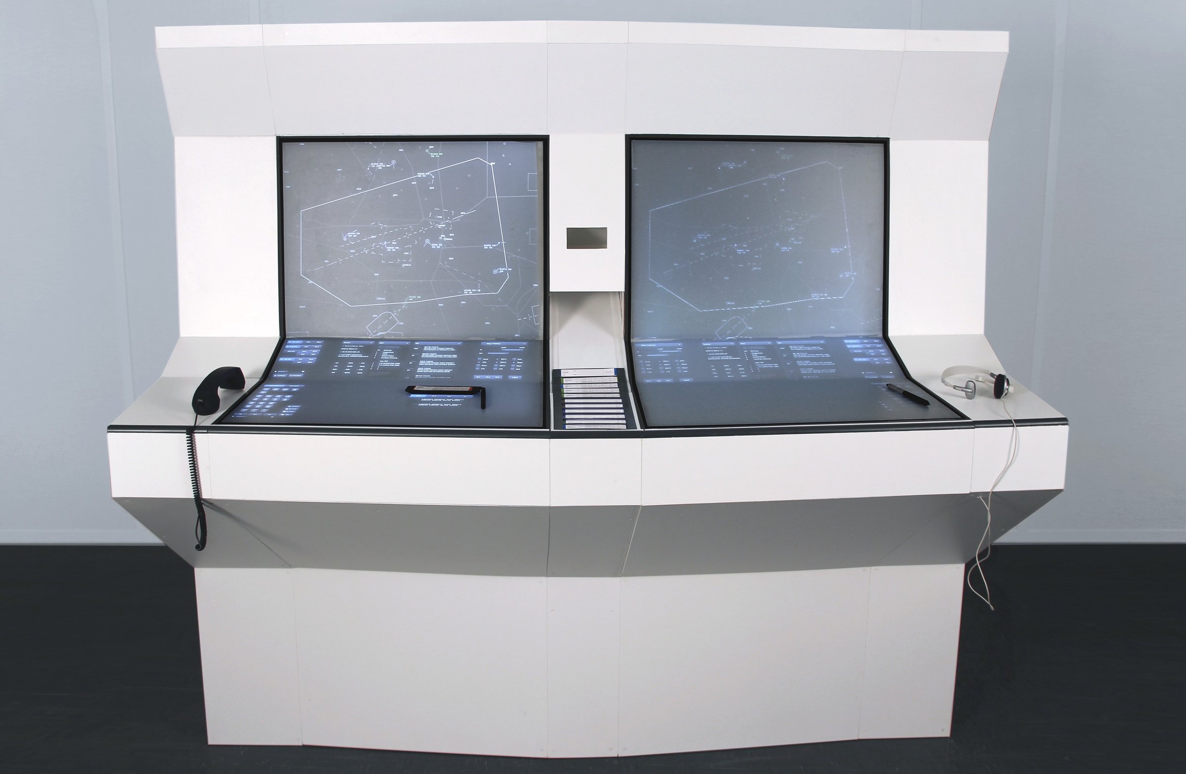 Full-scale TESS workstation model with two stepped surfaces and a shared central strip bay